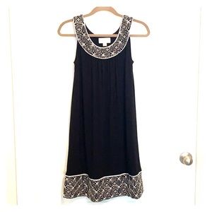 Black sleeveless scoop neck dress